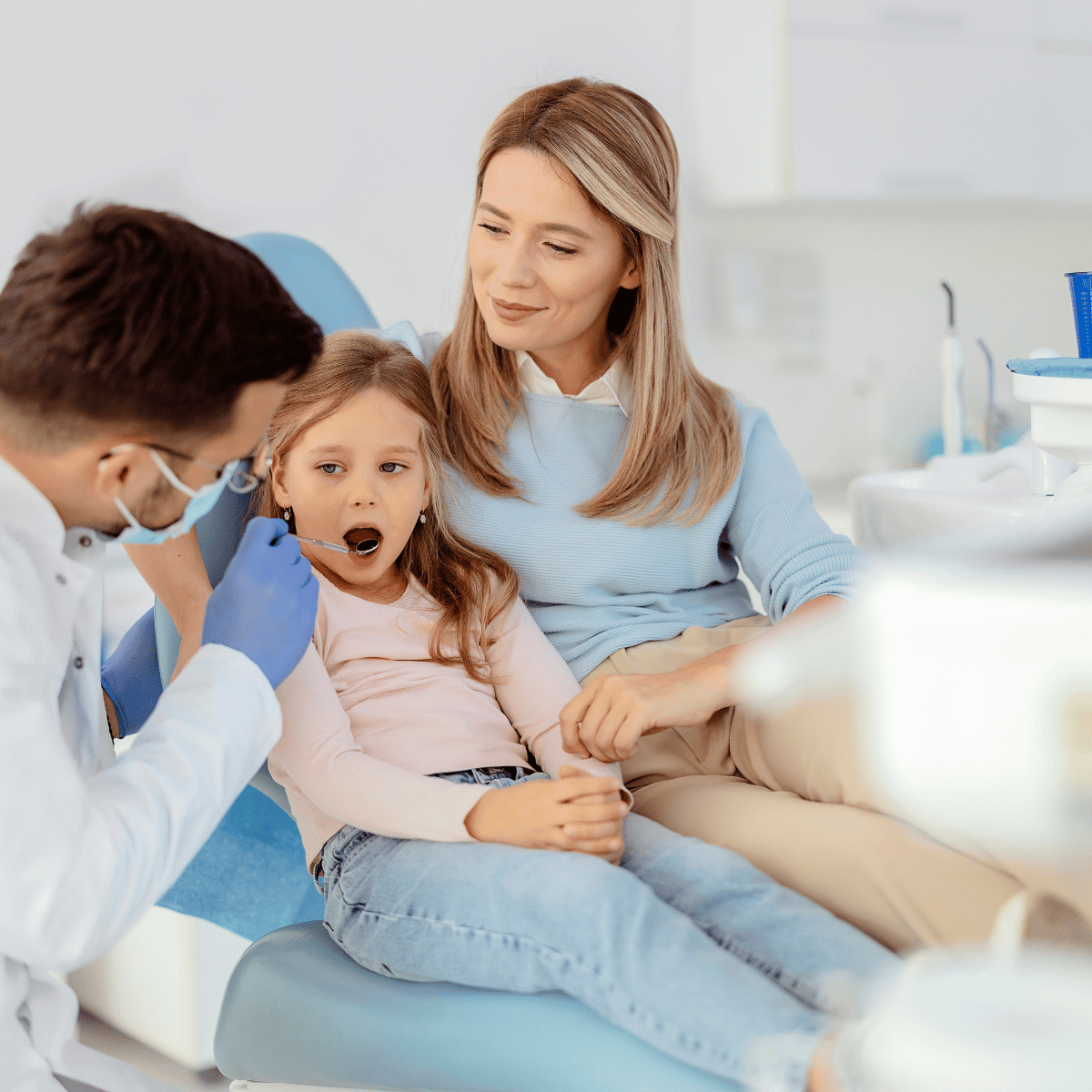 A kid dental patient with her mon to represent compassionate dental care for special needs patients